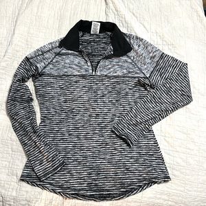 Avia black and gray half zip dry, fit top size medium.